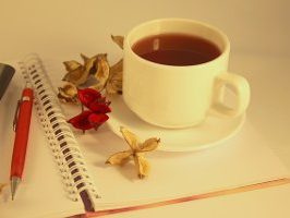 cup of tea on an open notebook